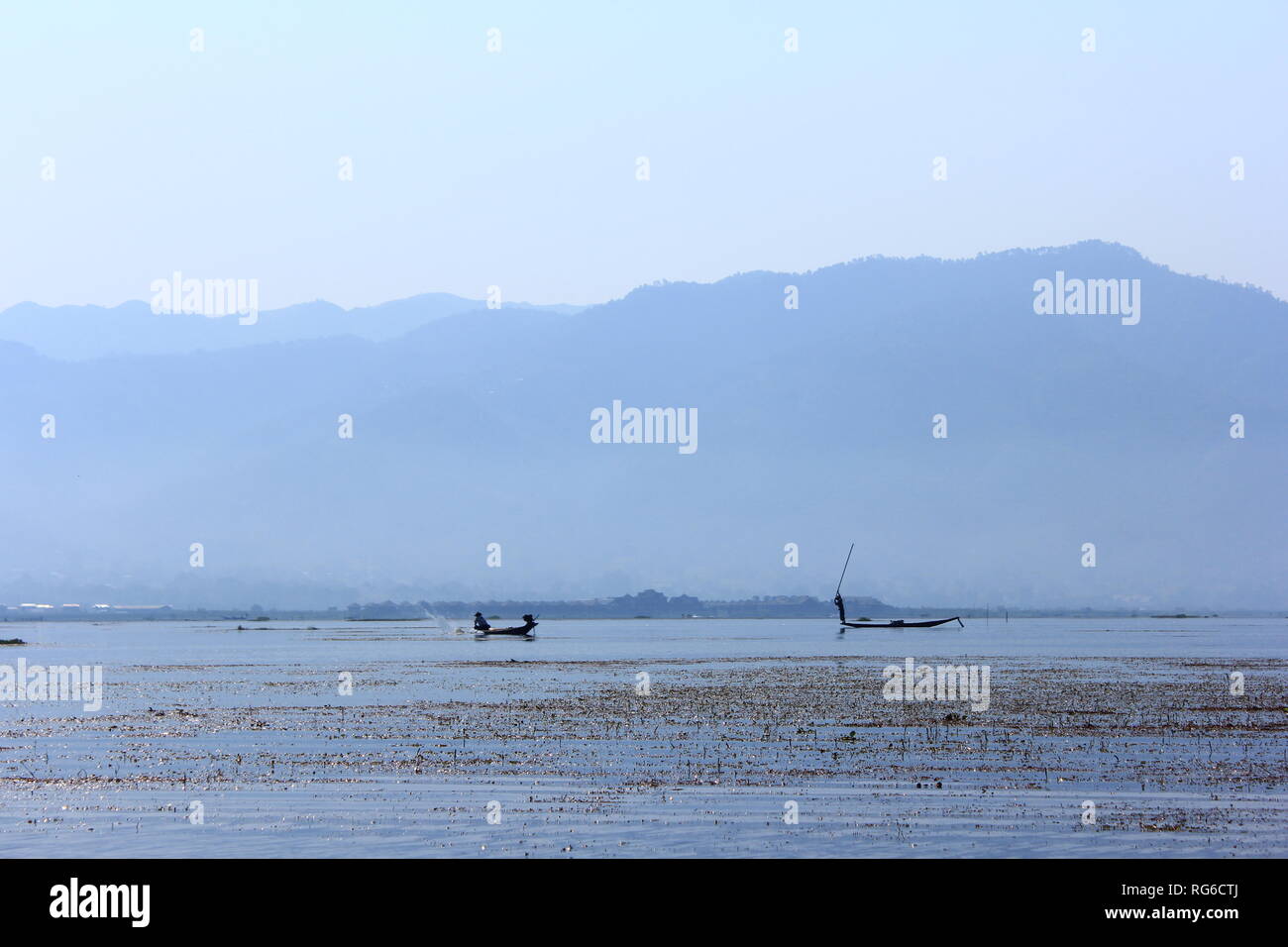 Fisherman working on a sunny day on Inle lake in Myanmar Stock Photo