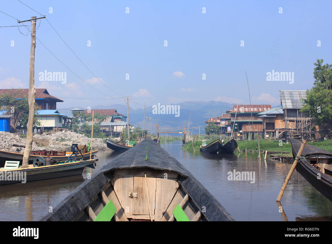 Boat ride across Inle lake and its green, quiet and calming landscape in Inle Lake, Myanmar Stock Photo