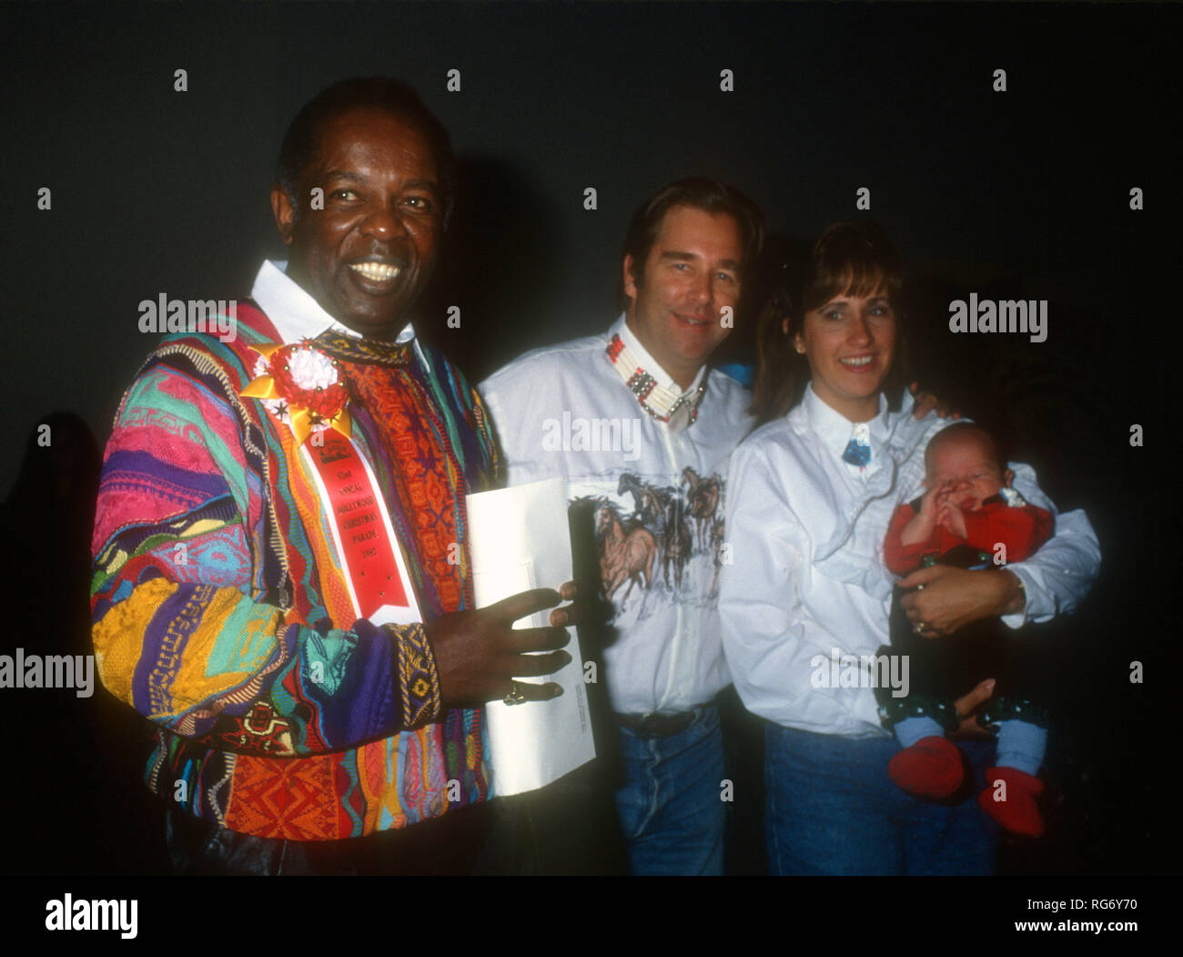 HOLLYWOOD, CA - NOVEMBER 28: Singer Lou Rawls, actor Beau Bridges and wife Wendy Treece Bridges attend the 62nd Annual Hollywood Christmas Parade on November 28, 1993 at KTLA Studios in Hollywood, California. Photo by Barry King/Alamy Stock Photo Stock Photo