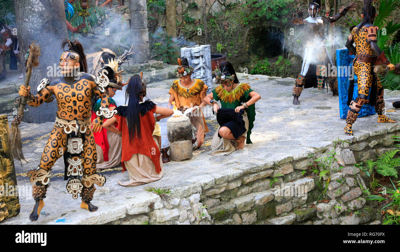 Pre-Hispanic Mayan amerindian people performance into the jungle in the ancient Mayan Village, Riviera Maya, Mexico Stock Photo