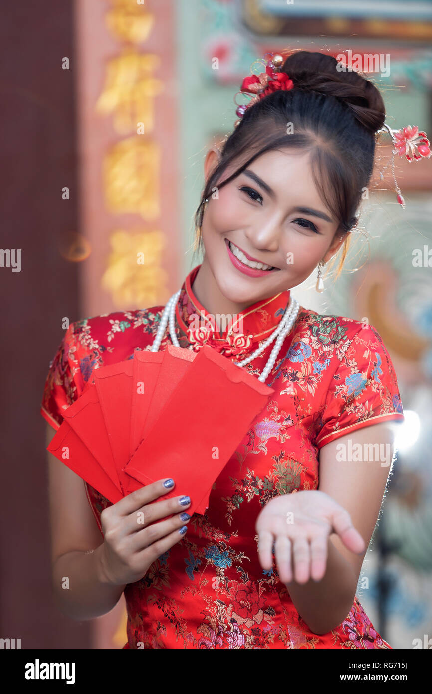 Portrait of Chinese woman wear traditional dress cheongsam and holding ...