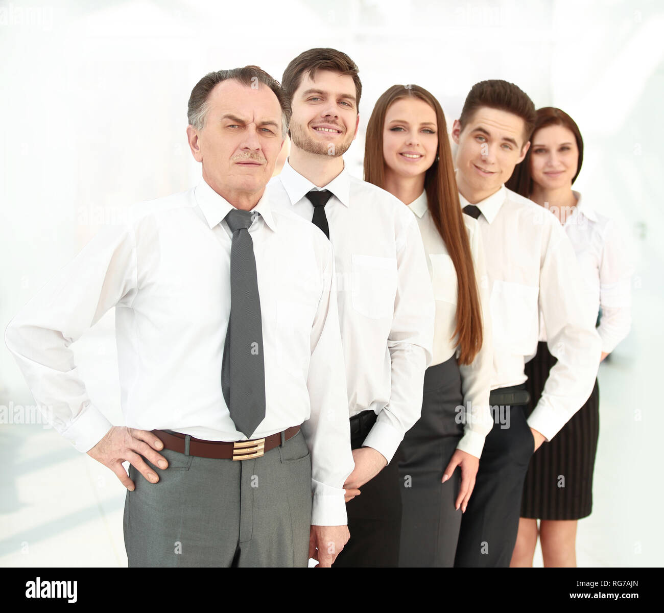 group of young business people standing in a row Stock Photo - Alamy