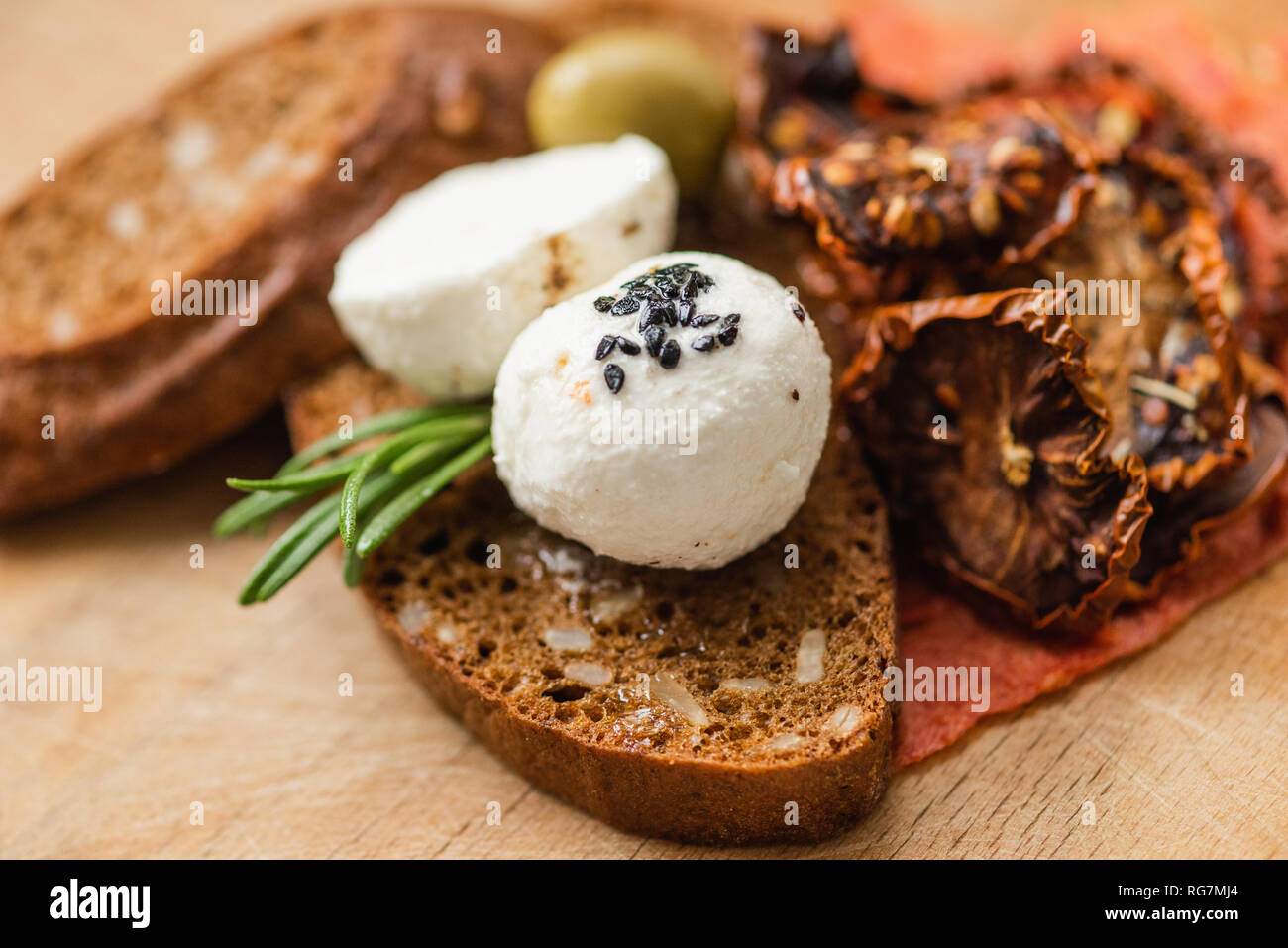Homemade cheese with with spices and dried Tomatoes Stock Photo