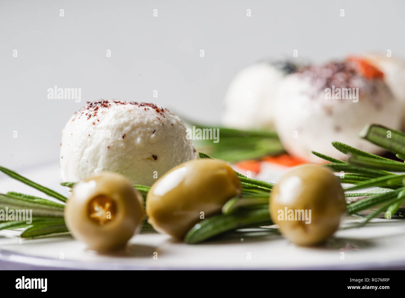 Fresh arabic cheese with Rosemary, Nigella, Kalindzhi, Sumy, Garam Masala on white background Stock Photo