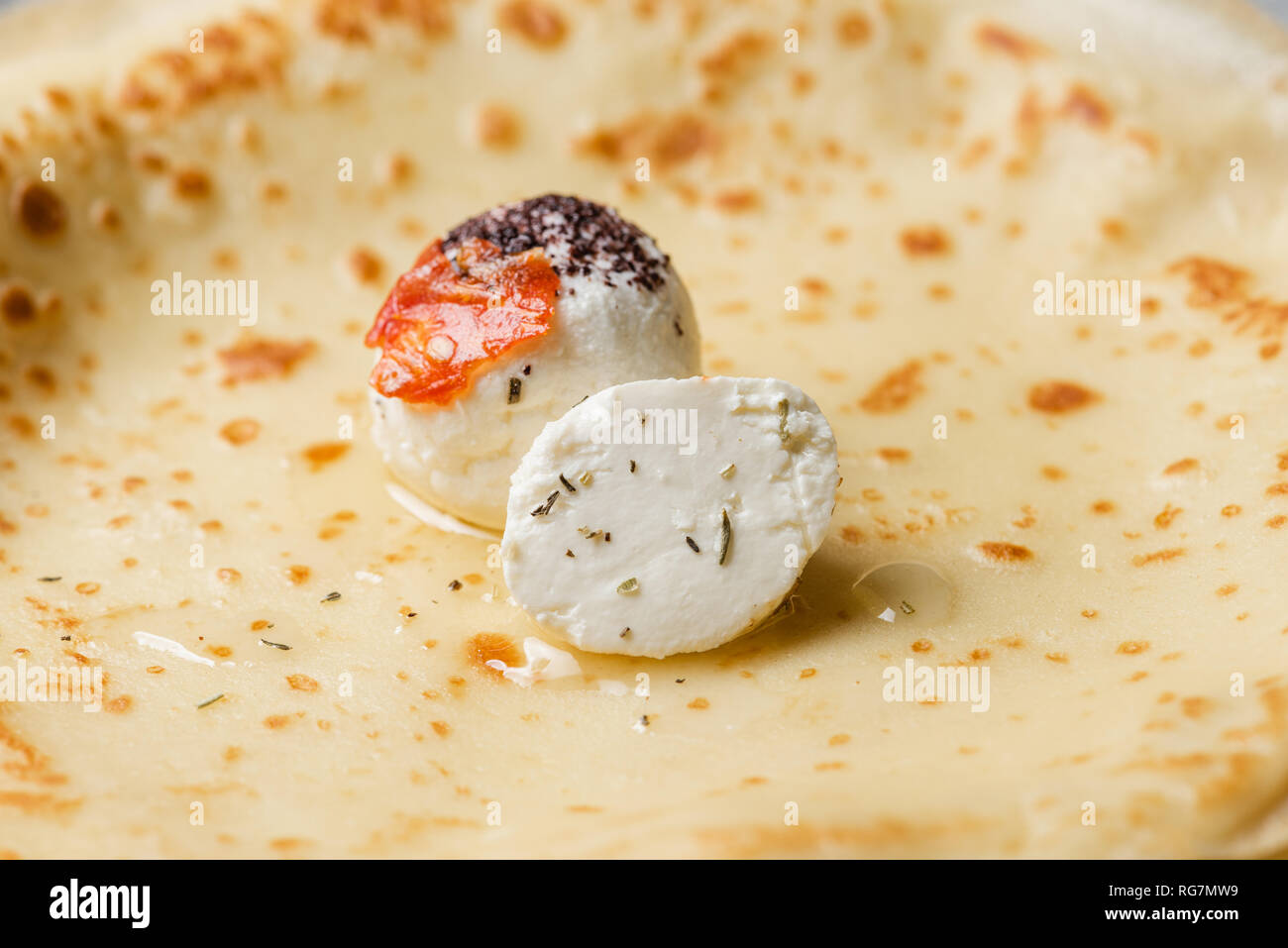 Labne cheese balls with spices on thin pancakes Stock Photo