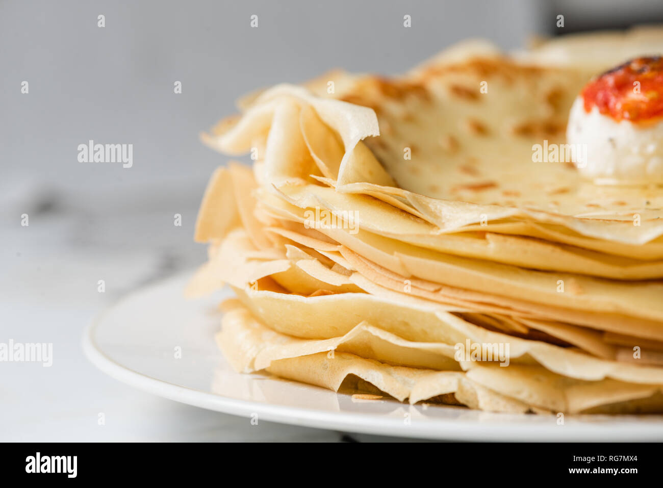 Close up of edge of the pancake with labne cheese Stock Photo