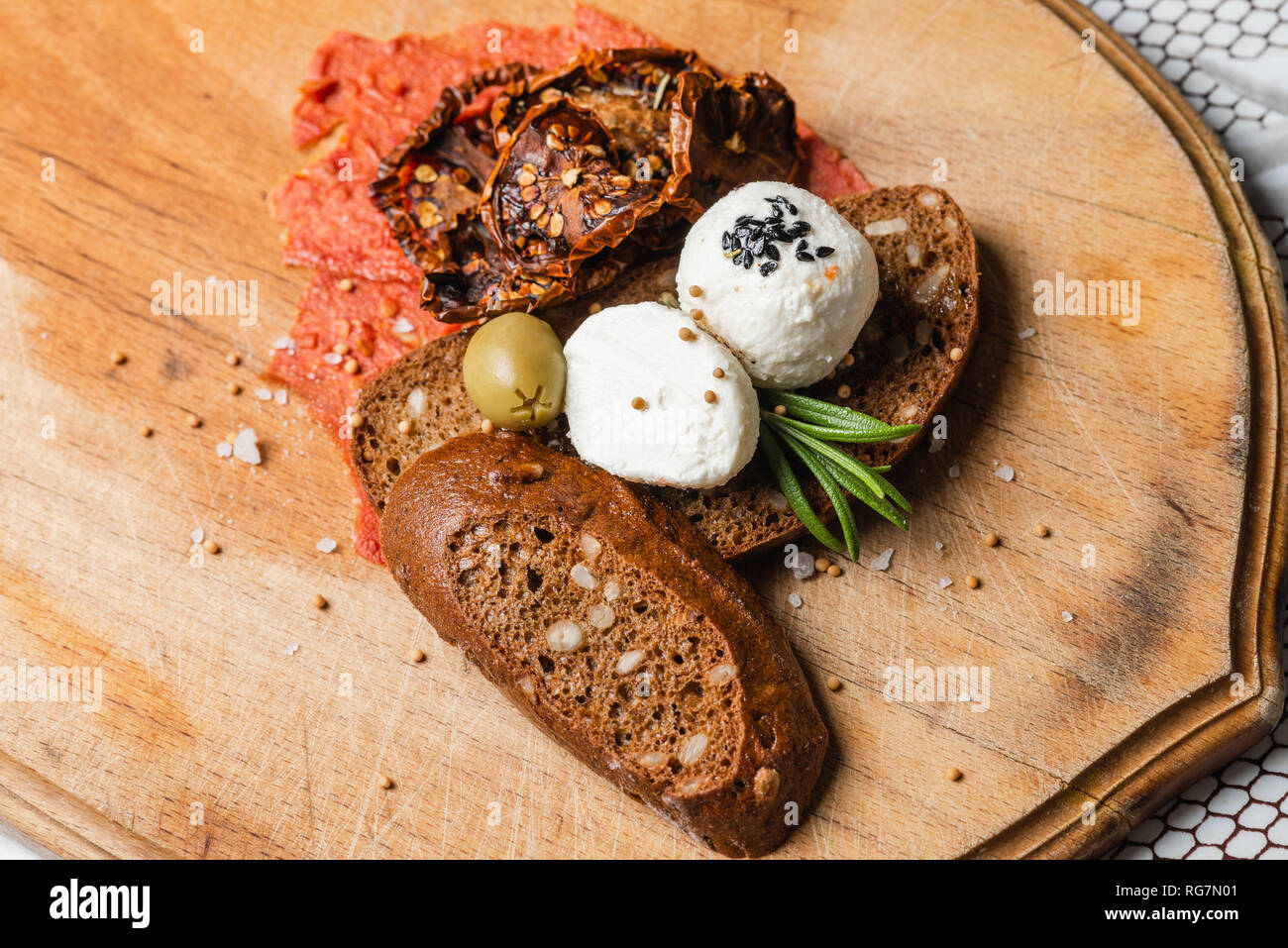 Arabic cheese balls with spices Rosemary, Nigella, Kalindzhi, Sumy, Garam Masala on wooden desk Stock Photo