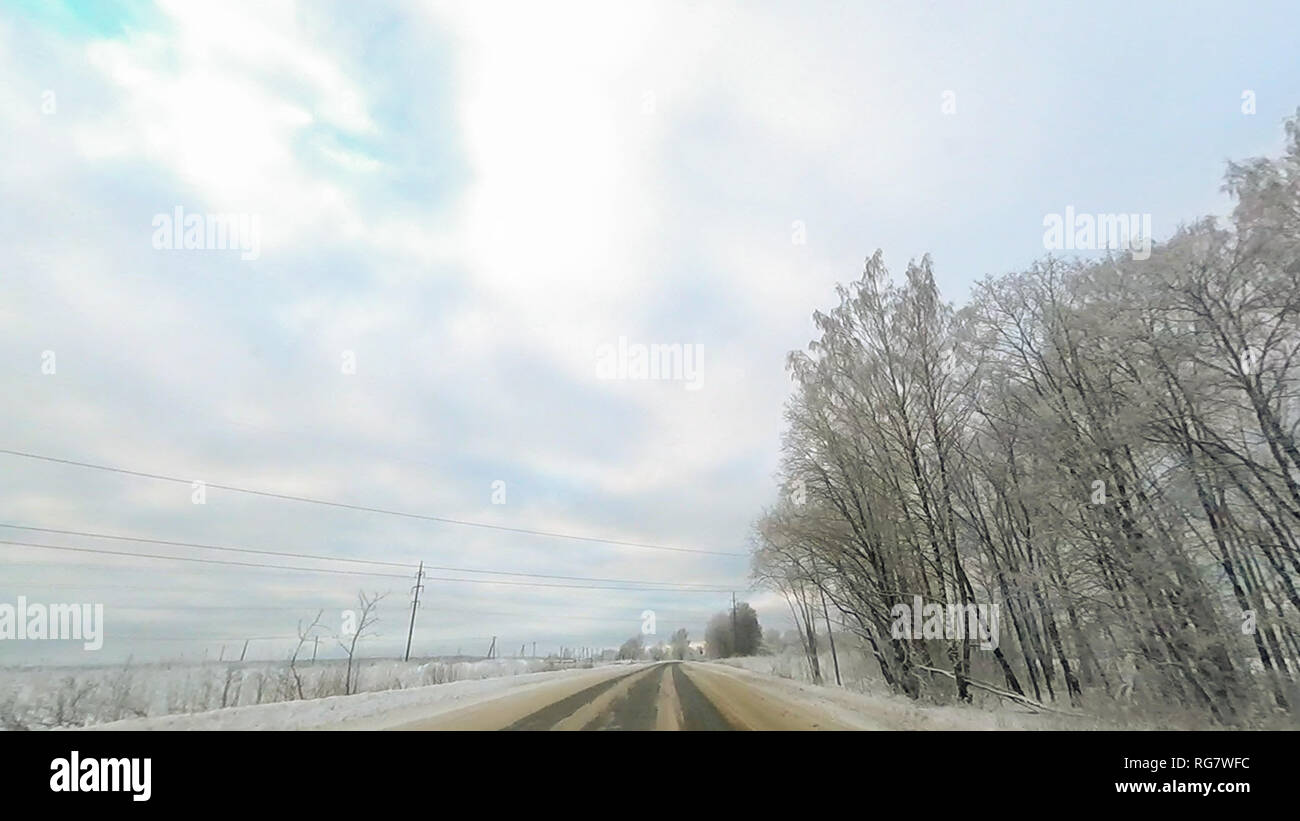 Country road in winter along the forest with white snow trees Stock ...