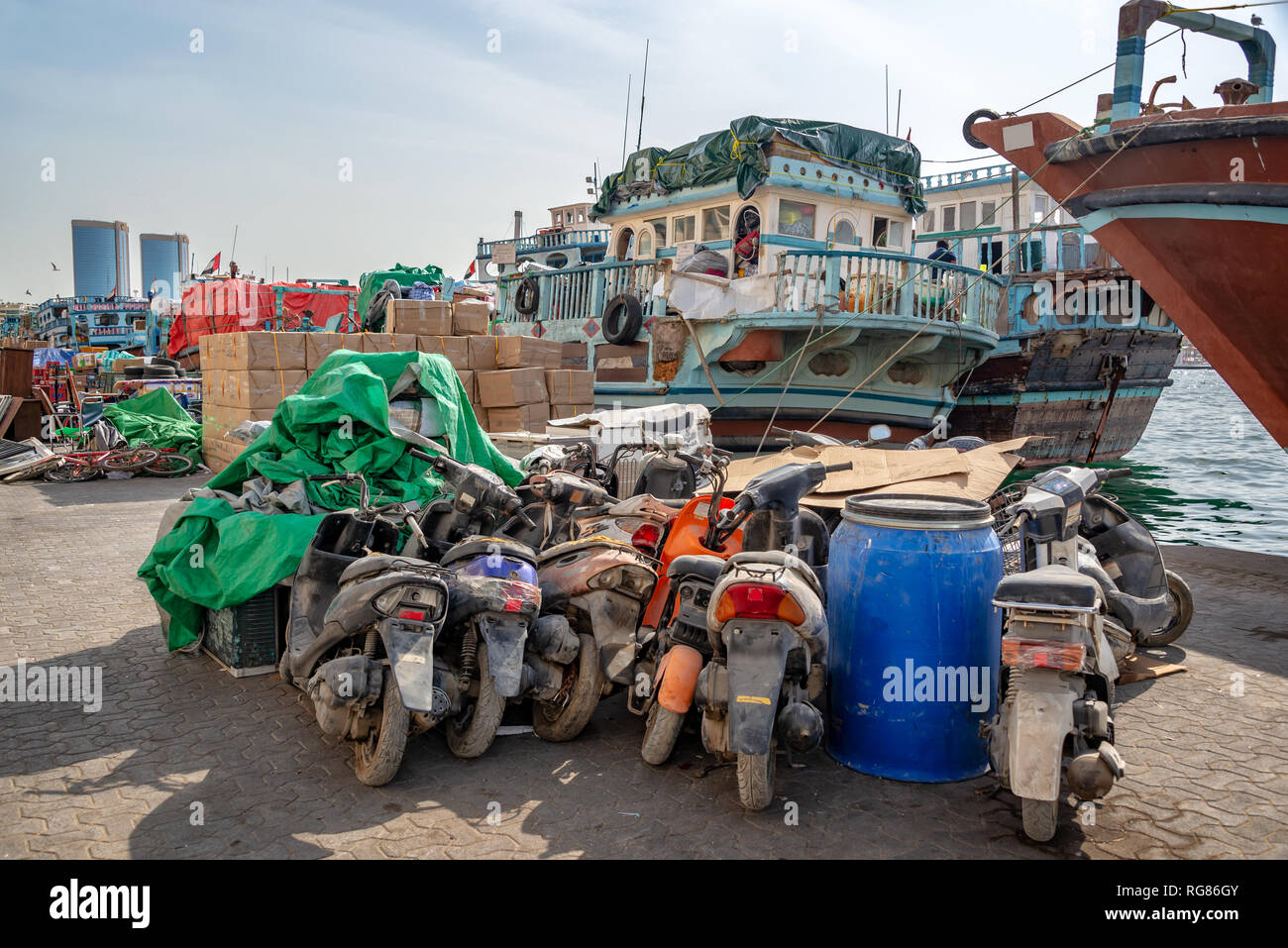 Wooden dhow cargo boats loaded with merchandise on Dubai Creek, United Arab Emirates Stock Photo