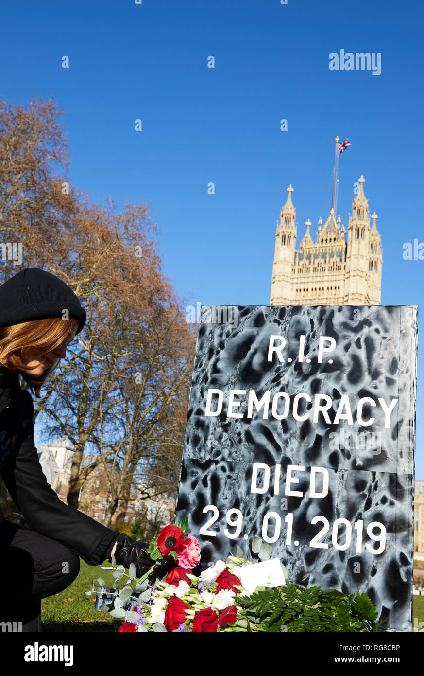 London, UK. - 28 Jan 2019: A tombstone saying RIP democracy is symbolically placed in front of Parliament before a vote on Theresa May's deal in Parliament. Credit: Kevin J. Frost/Alamy Live News Stock Photo