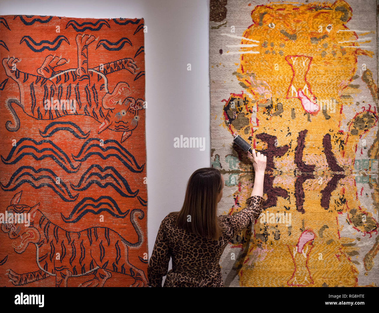 Sotheby’s, New Bond Street, London, UK. 28 January, 2019. WWF Tomorrow’s Tigers, a major new fundraising project devised and curated by Artwise, features specially commissioned, limited edition art rugs by 10 internationally renowned artists: Francesco Clemente, Bernard Frize, Gary Hume, Reena Saini Kallat, Anish Kapoor, Maya Lin, Harland Miller, Raqib Shaw, Kiki Smith, Rose Wylie. Image (right): Rose Wylie, Tiger Tiger, 2018-2019. Courtesy the Artist, David Zwirner, NY and CHOI&LAGER, Cologne/Seoul £18,000.00. Credit: Malcolm Park/Alamy Live News Stock Photo