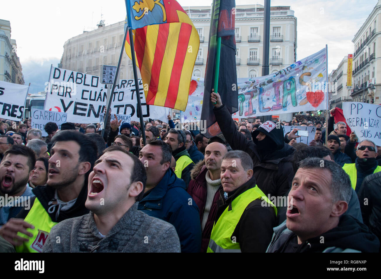 Taxi drivers seen shouting slogans in support of the protest during the strike. Due to a lack of an agreement, hundreds of taxi drivers protested at Puerta del Sol, Madrid’s central square. Taxi drivers in Madrid have been on a strike for more than a week demanding the prohibition of Uber and Cabify in the Spanish capital-city. Stock Photo