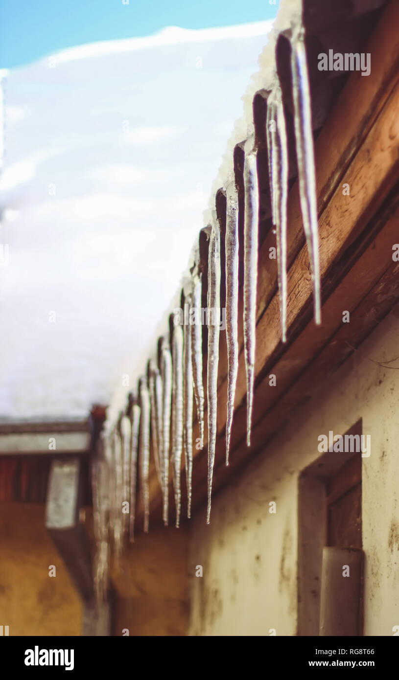 Dangerous icy hanging from the roof Stock Photo Alamy