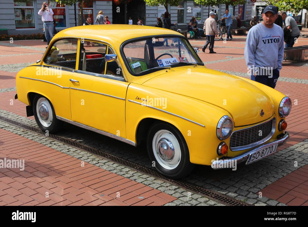 BYTOM, POLAND - SEPTEMBER 12, 2015: People admire FSO Syrena 105 during 12th Historic Vehicle Rally in Bytom. The annual vehicle parade is one of main Stock Photo
