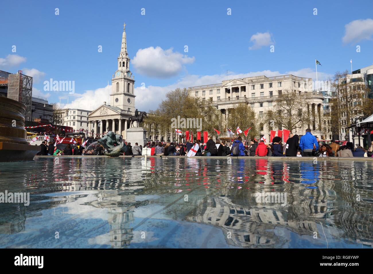 LONDON, UK - APRIL 23, 2016: People visit Trafalgar Square for Saint George's Day in London, UK. Saint George is the patron saint of England. Stock Photo