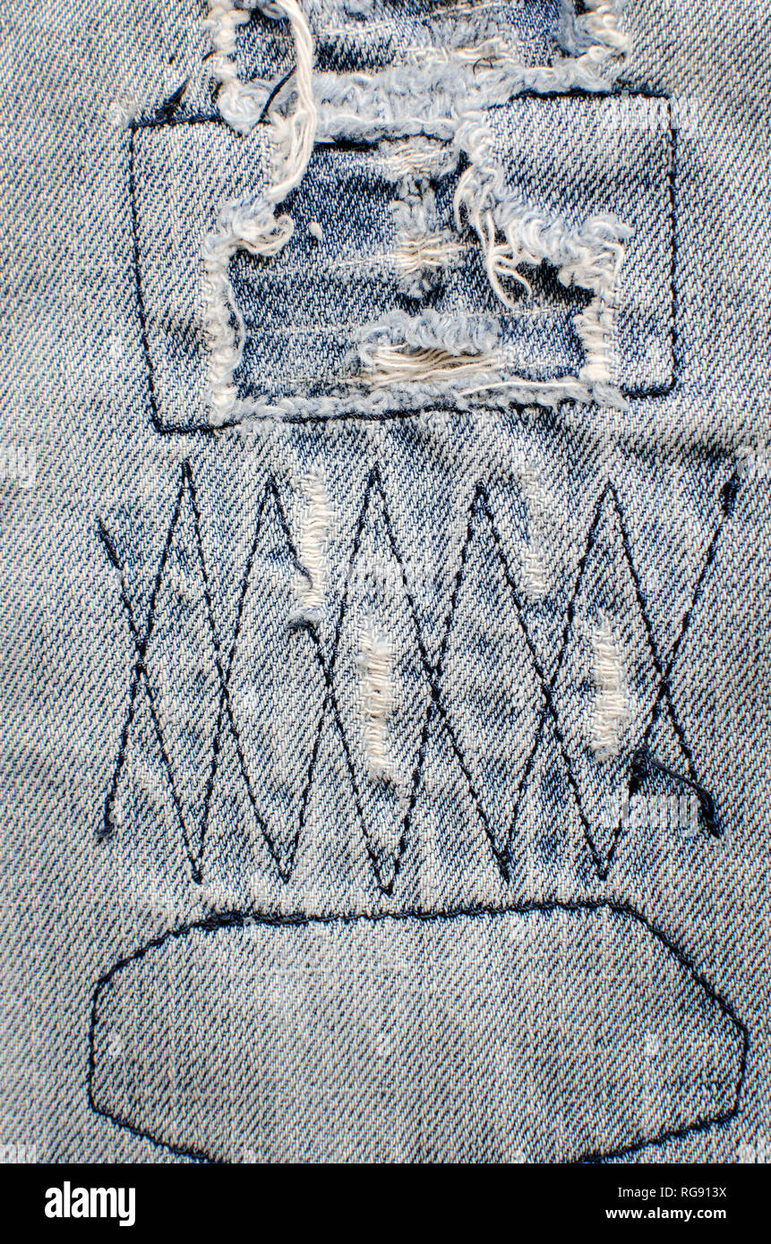 Denim jeans texture or denim jeans background with old torn Stock Photo