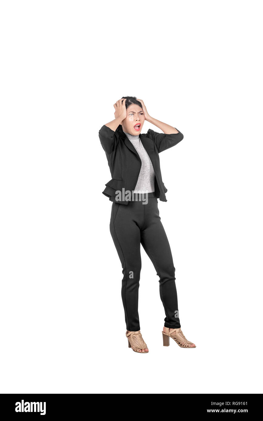 Stressed asian business woman pulling her hair posing isolated over white background Stock Photo