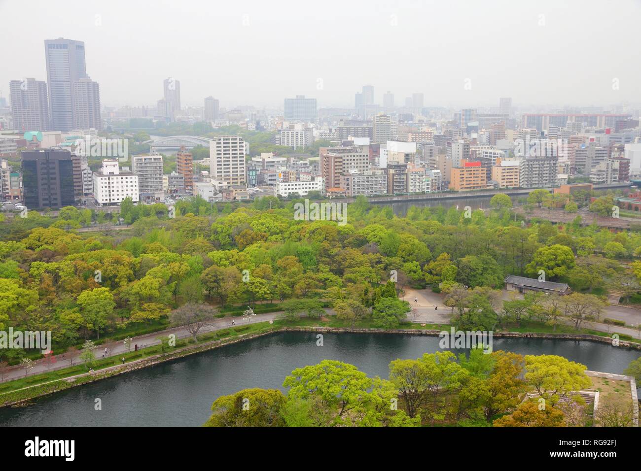 Osaka, Japan - skyline of famous city in the region Kansai. Modern metropolis - aerial view with air pollution smog haze. Stock Photo