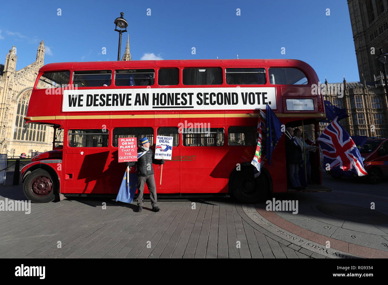 Anti-Brexit campaigner Steve Bray stands in front of a bus with a slogan calling for a second referendum, outside the Houses of Parliament in London. Stock Photo