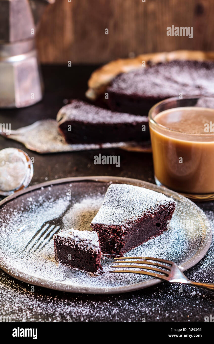 Swedish kladdkaka, dark chocolate cake, swedish brownie with coffee Stock Photo
