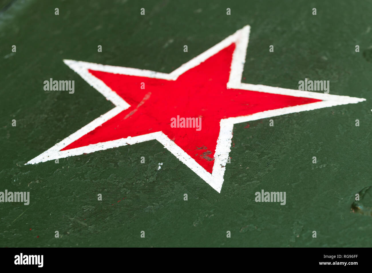 Red star with white border on green steel plate. Sign of Soviet Workers and Peasants Red Army on tank body from World War II period Stock Photo