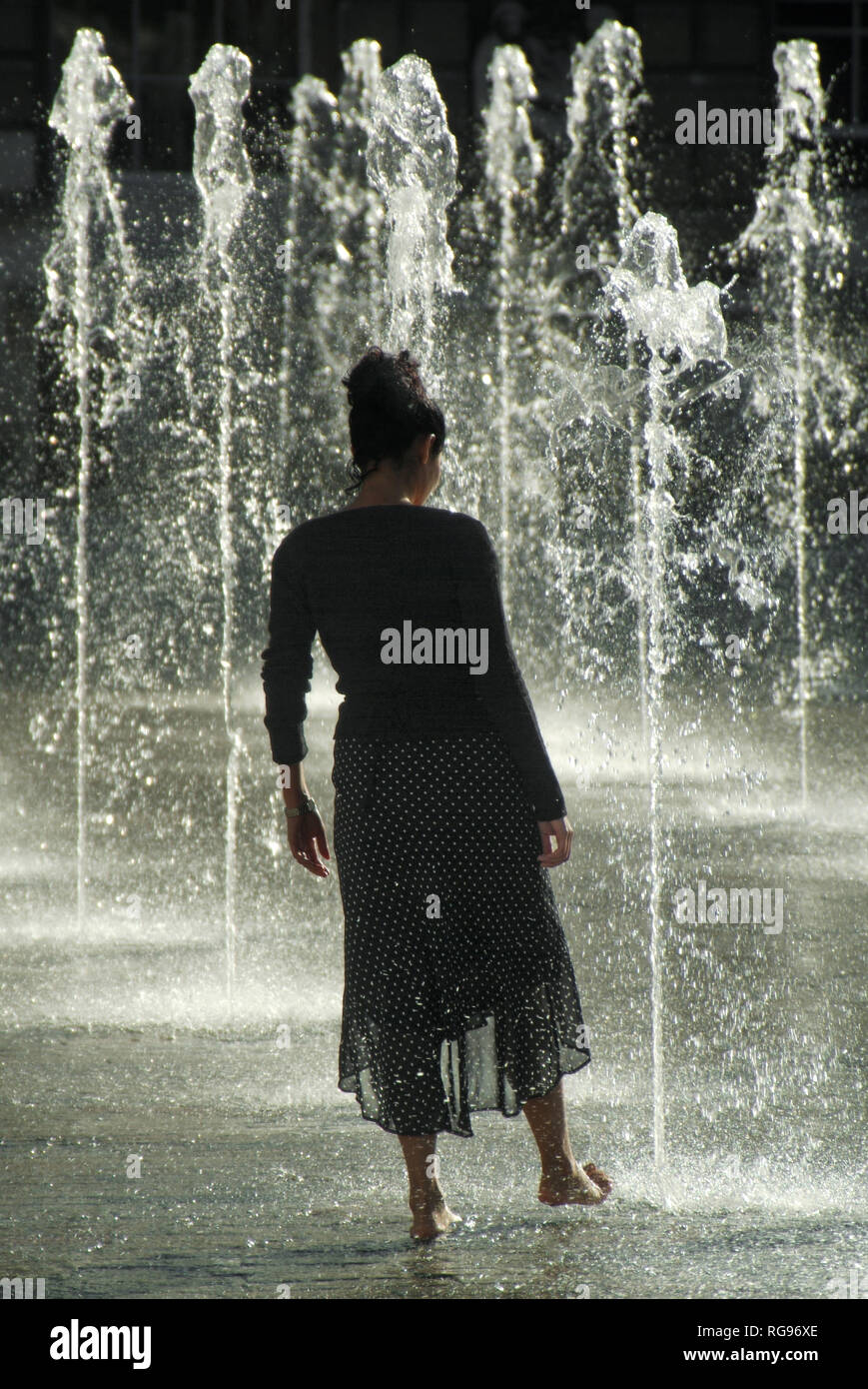 Long cool woman in a black dress hi-res stock photography and images - Alamy