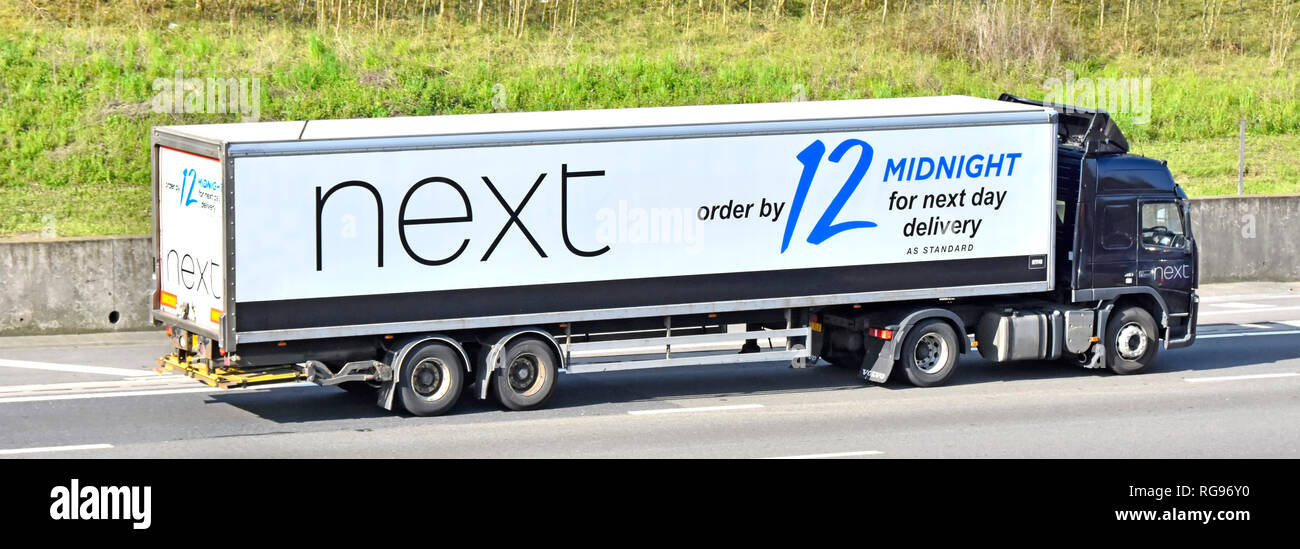 Side view of Next hgv lorry truck & trailer on motorway with brand  advertising for order & buying before 12 midnight for delivery next day  England UK Stock Photo - Alamy