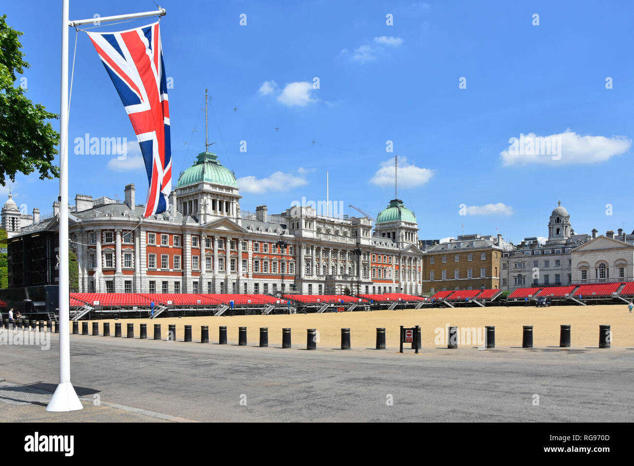 Security bollards protection on Horse Guards Parade Ground summer events & historic old building facades union jack flag in iconic London England UK Stock Photo