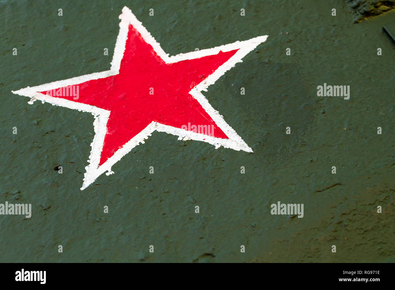 Red star on green steel plate. Sign of Soviet Workers and Peasants Red Army on tank body from World War II period Stock Photo