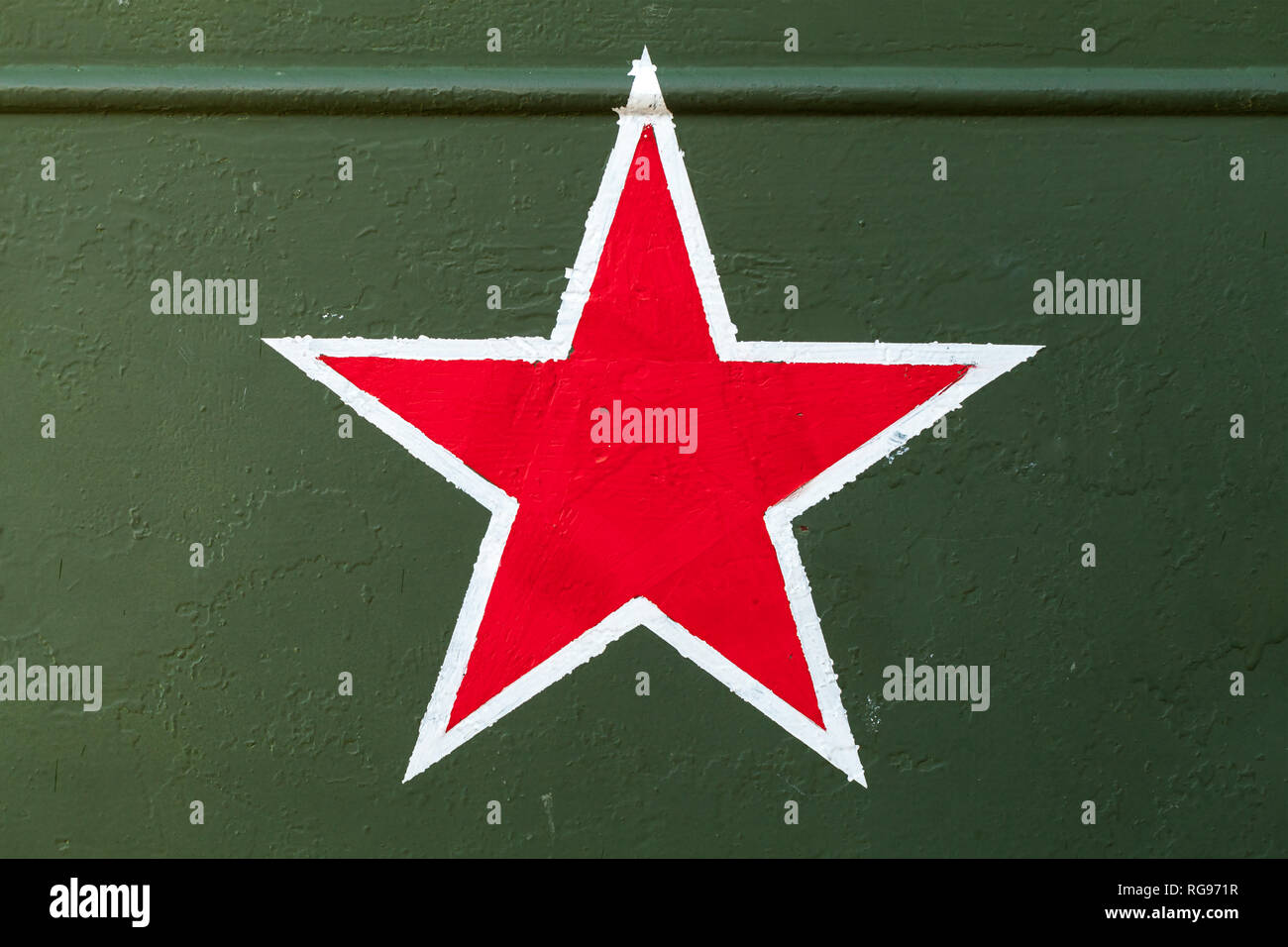 Red star on green steel plate. Soviet Workers and Peasants Red Army sign Stock Photo