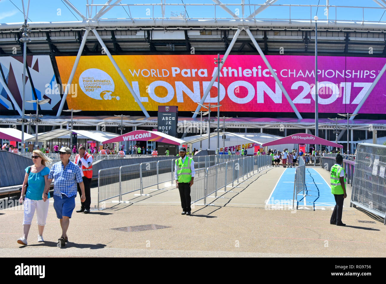 Stewards at spectator barriers to London 2017 World paralympics athletics championships games London stadium Queen Elizabeth Olympic Park Stratford UK Stock Photo