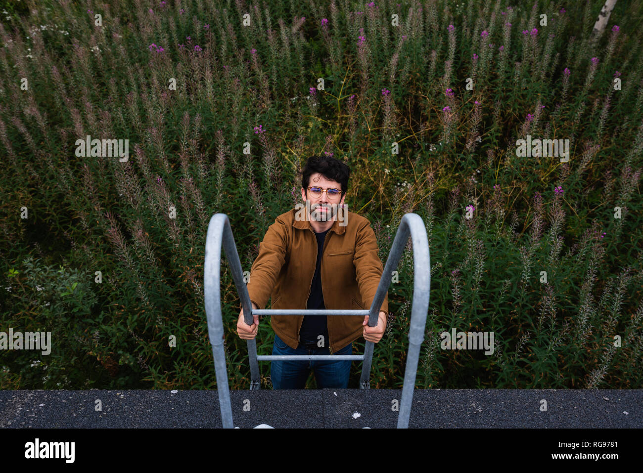 Man climbing up stairs Stock Photo