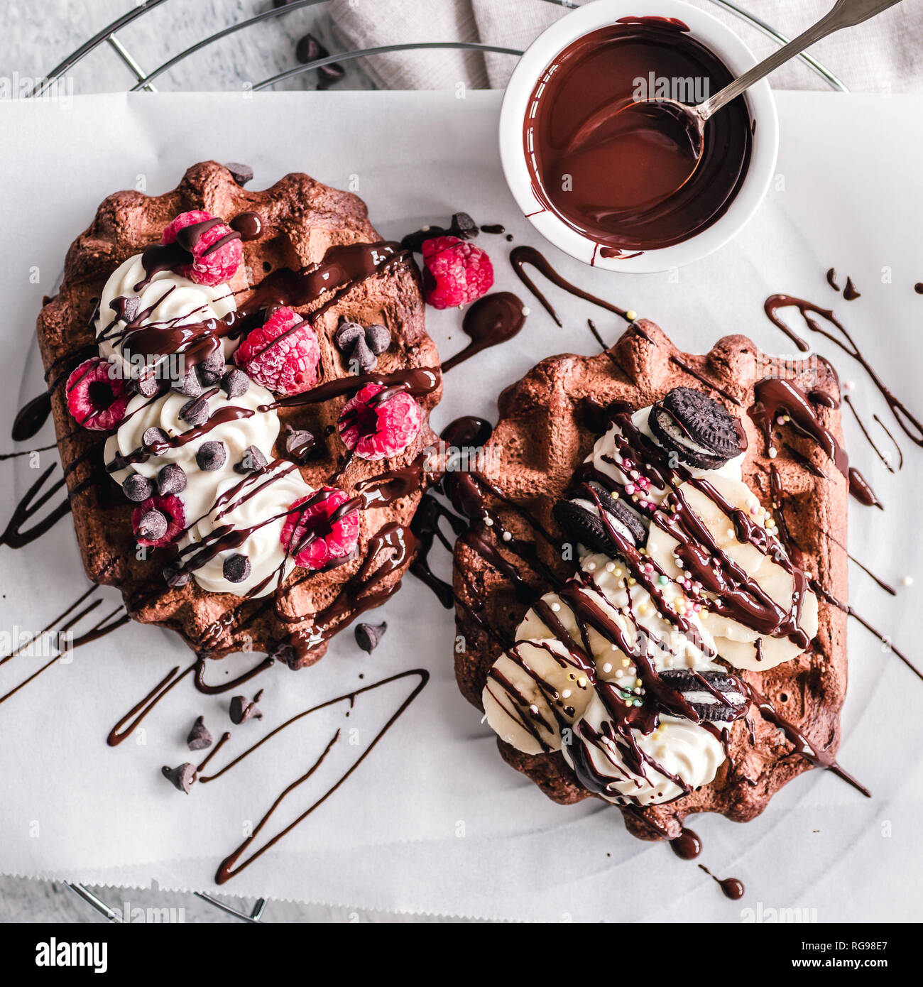 Chocolate Waffles With Cream Chocolate Sauce Fruit And Chocolate Sandwich Cookies Stock Photo Alamy