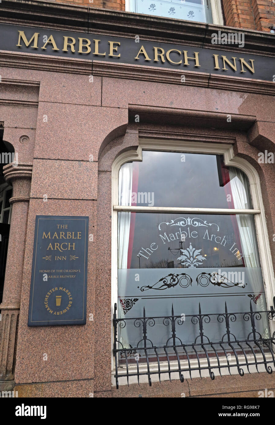 The Grade II listed Marble Arch Inn, Manchester, with its historic pub sign, sash window and decorative granite facade, Rochdale Road, M4 4HY Stock Photo