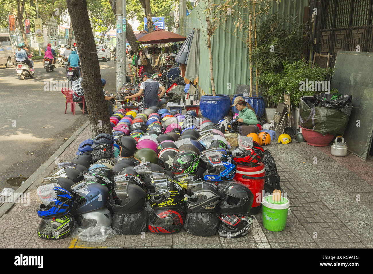 Street seller of helmets in Ho Chi Minh, Vietnam Stock Photo