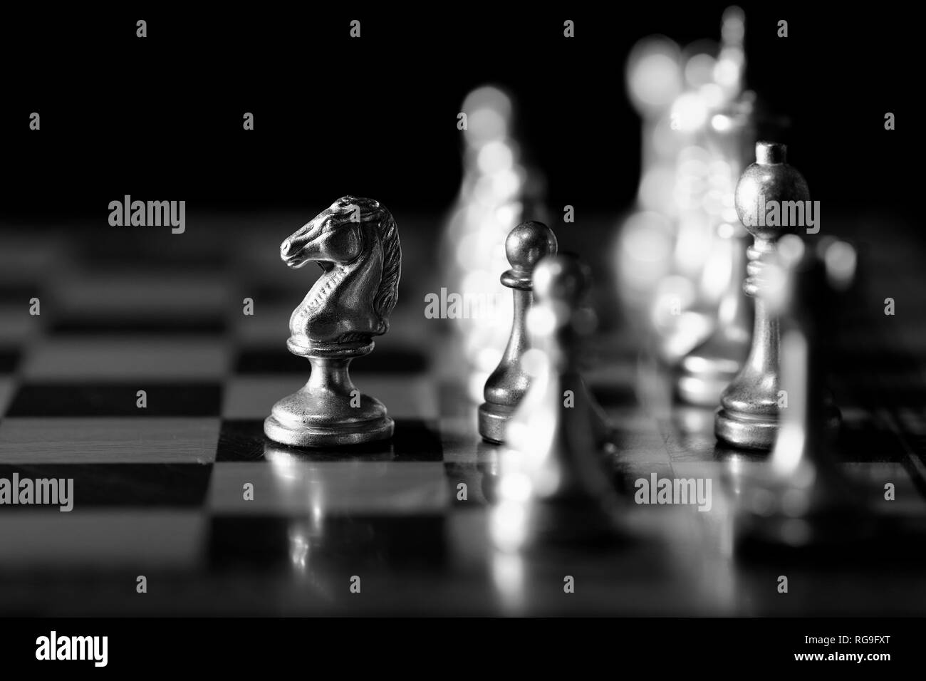 Pieces on chess board for playing game and strategy knight kingdom gaming Stock Photo