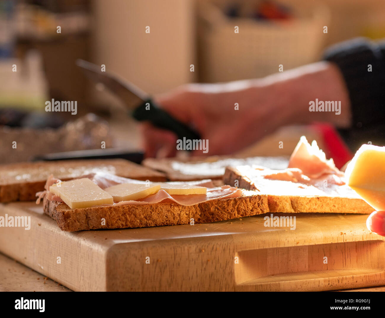 Woman making sandwiches in the kitchen Stock Photo