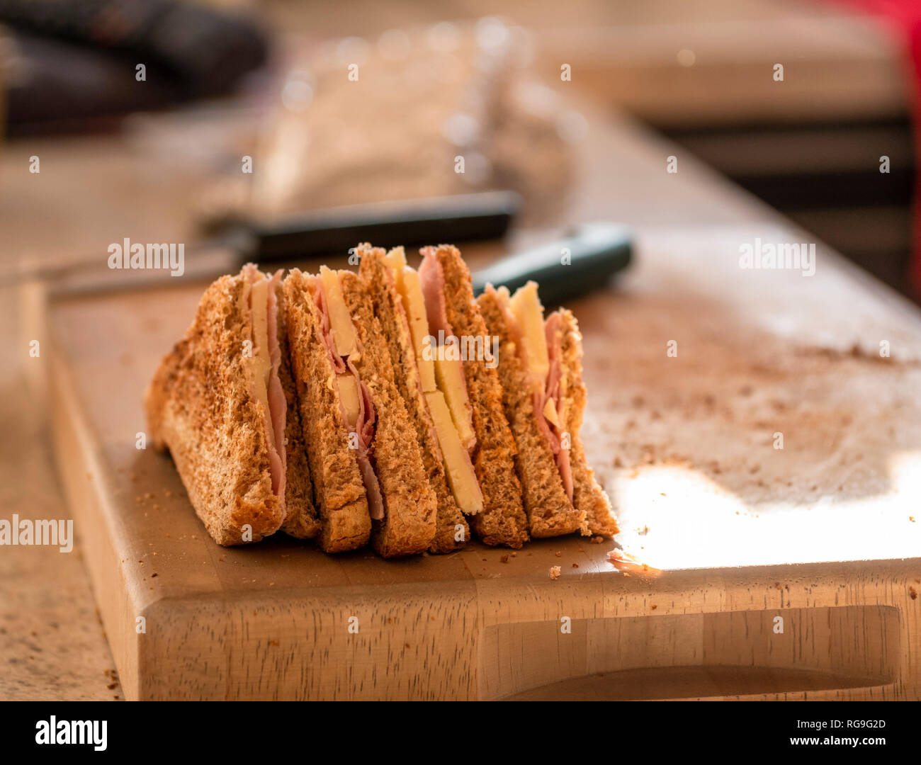 Ham and cheese sandwiches on a cutting board Stock Photo