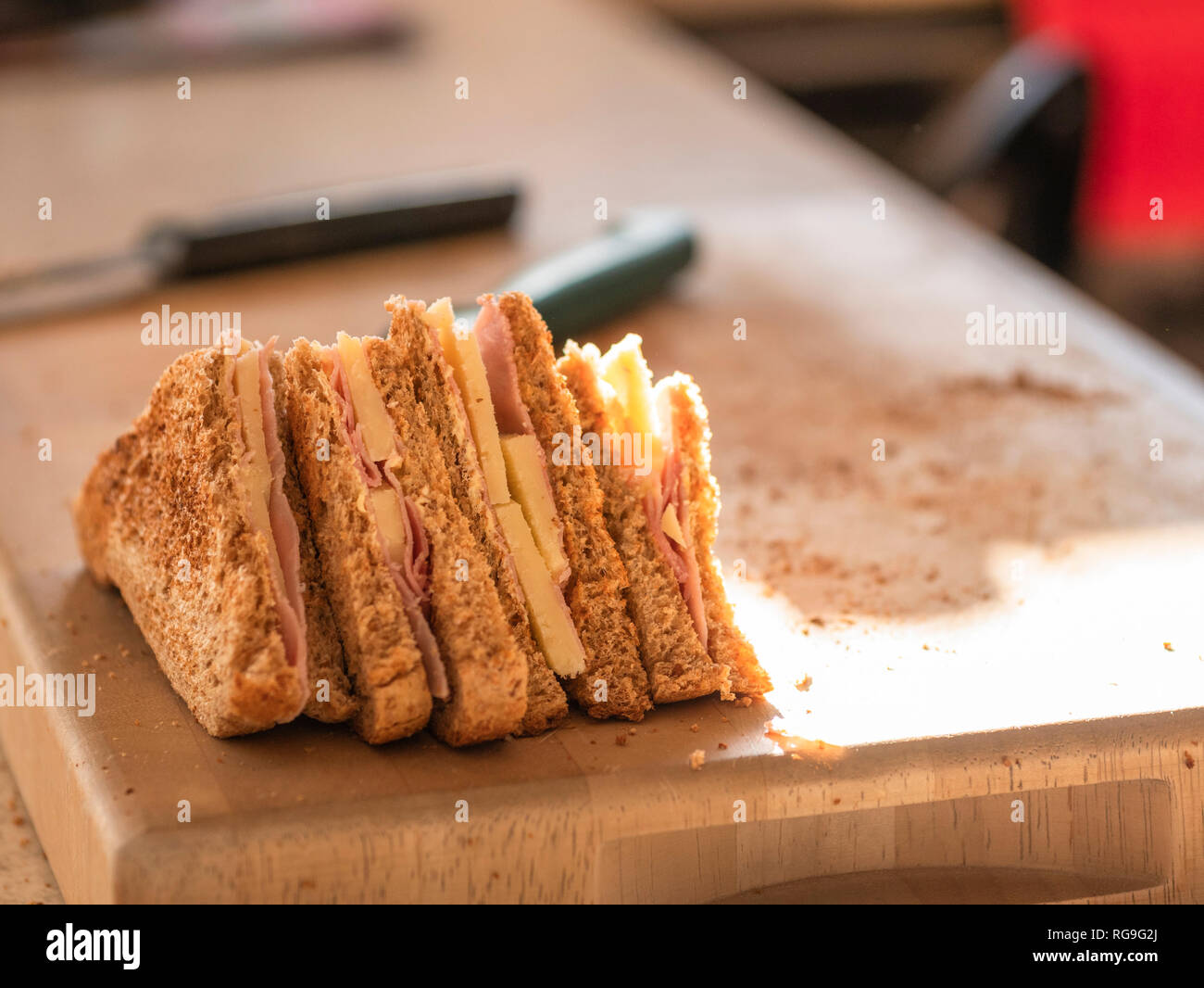 Ham and cheese sandwiches on a cutting board Stock Photo