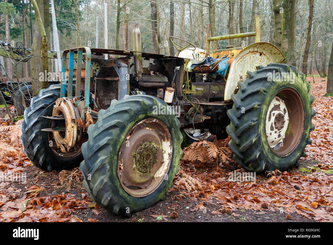 Disused logging tractor in a managed woodland in Norflk, UK Stock Photo