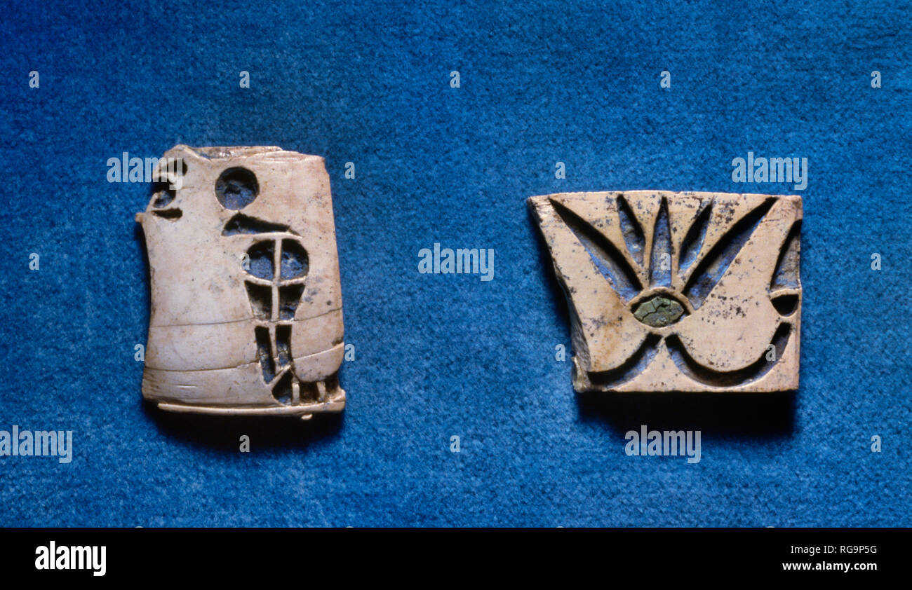 Inlaid panel fragments: Nimrud Ivory from Room SW37 Fort Shalmaneser within Assyrian city of Nimrud, Iraq, photographed in the Iraq Museum, Baghdad. Stock Photo