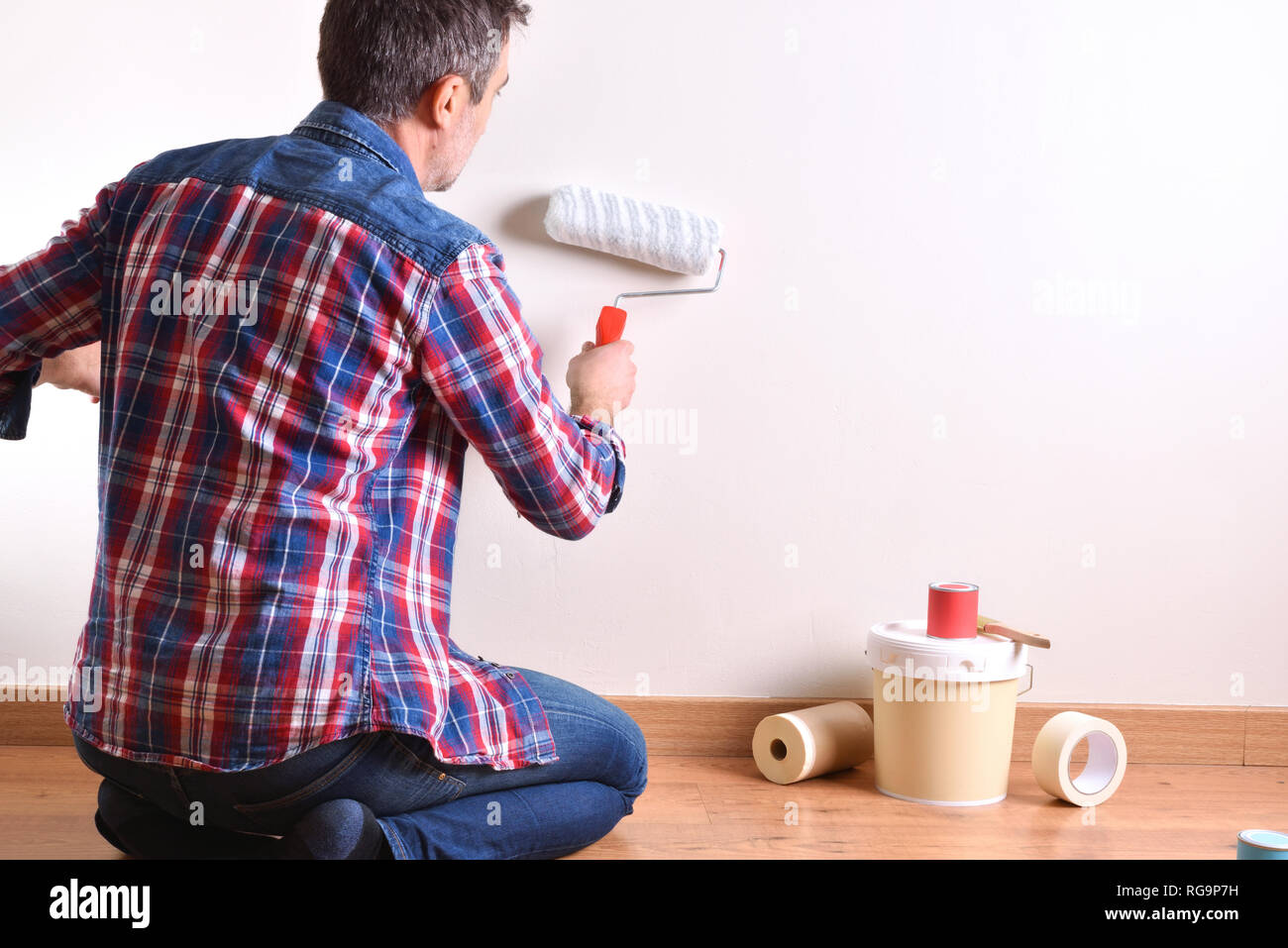 Man kneeling on floor hi-res stock photography and images - Alamy