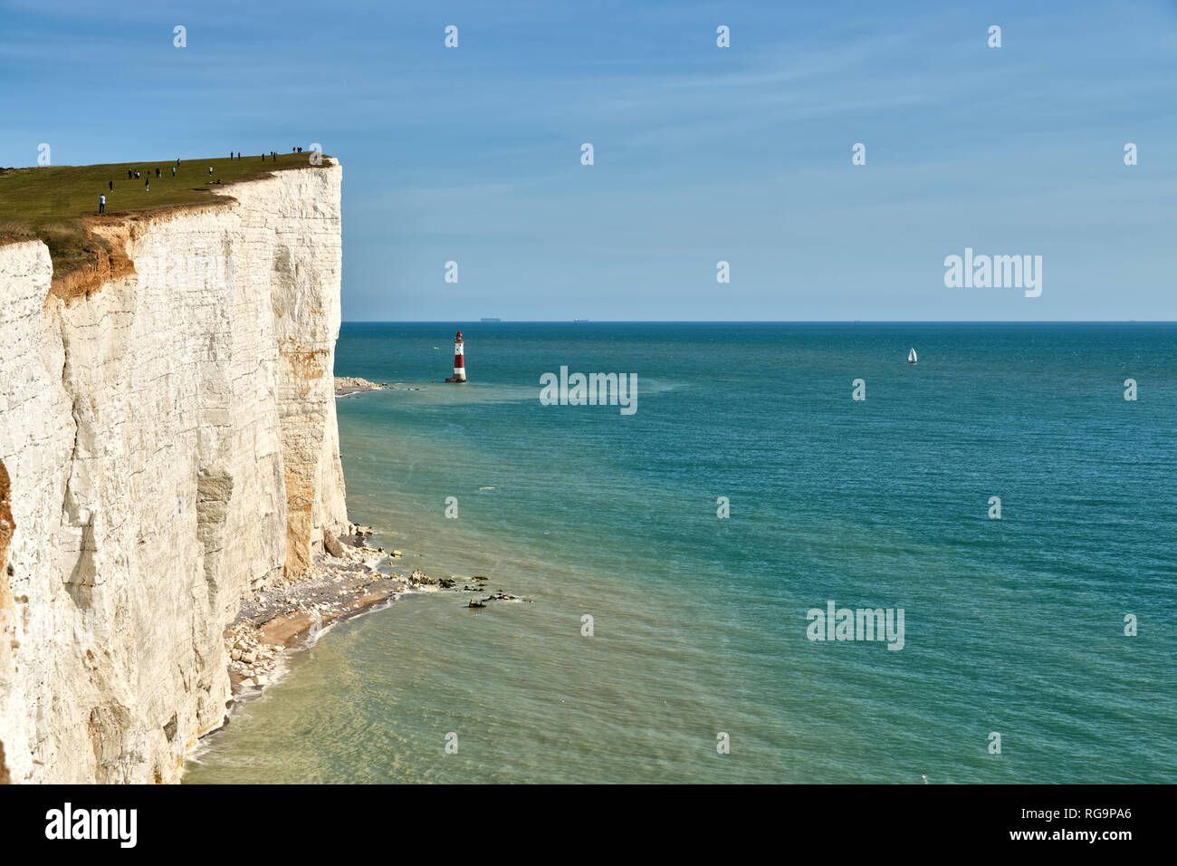 A view of Beachy Head lighthouse and the high chalk cliffs on the East Sussex coast. Stock Photo