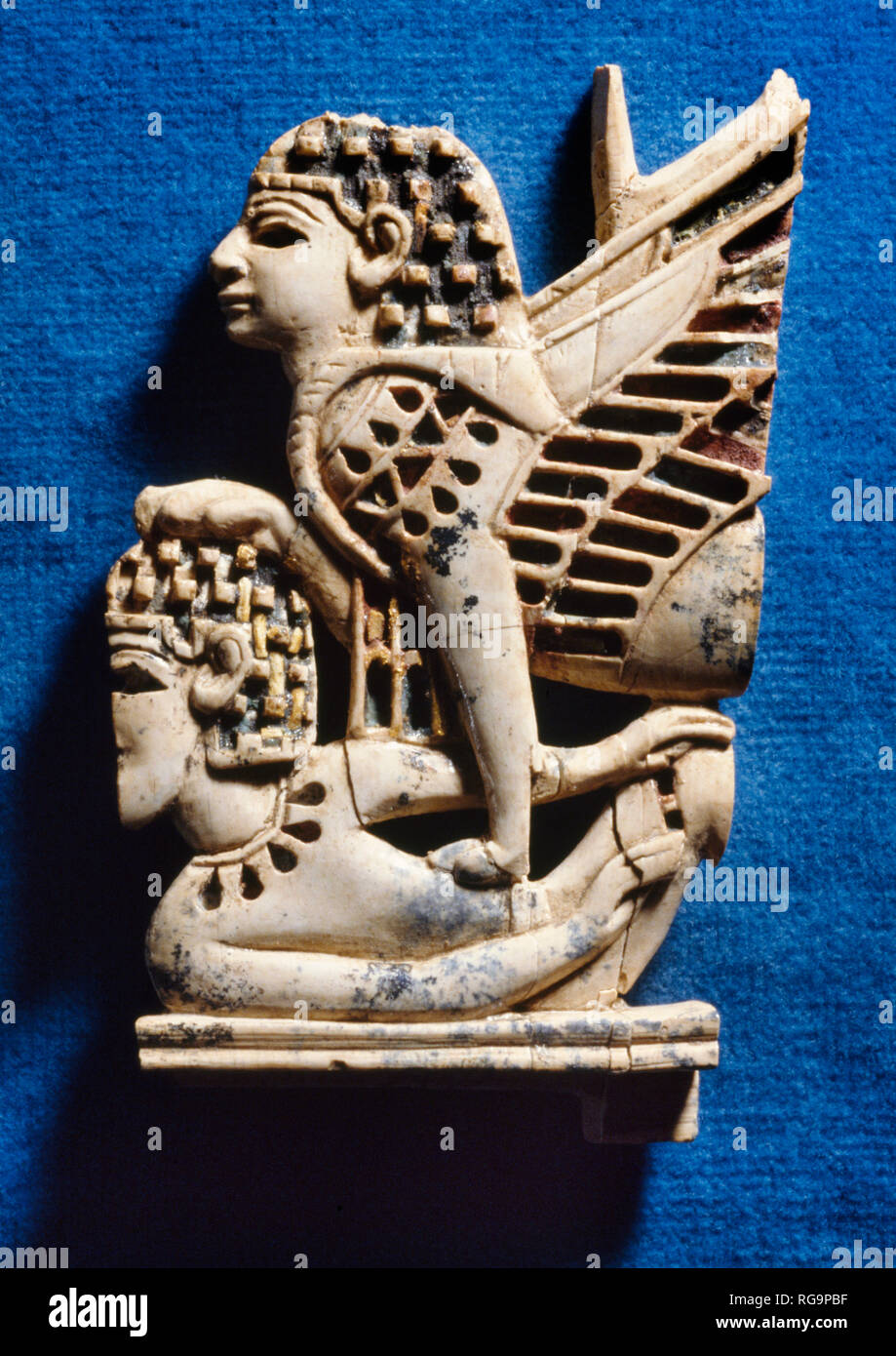 Sphinx subdues youth: Nimrud Ivory from Room SW12 Fort Shalmaneser within the Assyrian city of Nimrud, Iraq, photographed in the Iraq Museum, Baghdad. Stock Photo