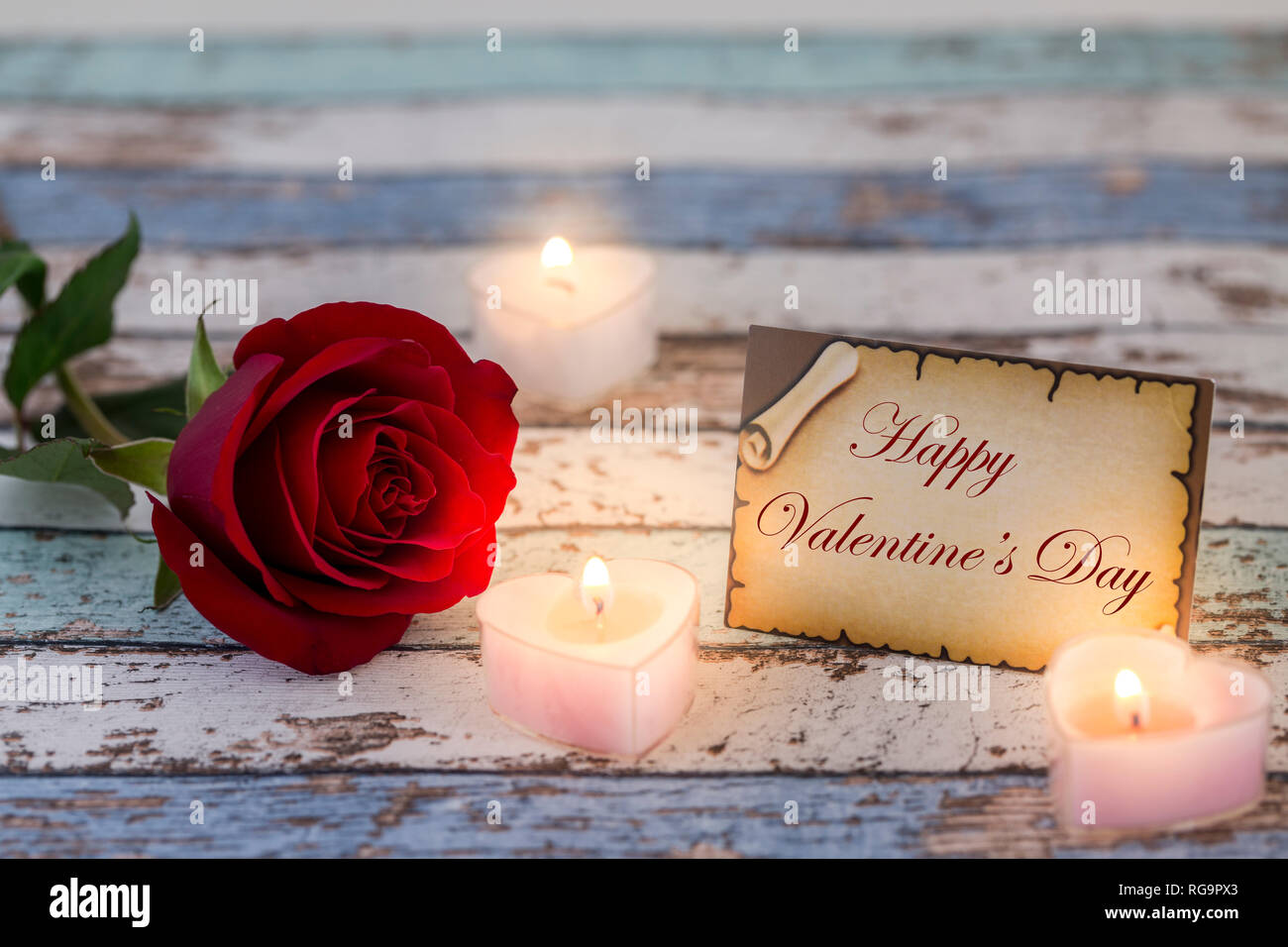 Greeting card with Happy Valentine's Day text, single red rose, and ...