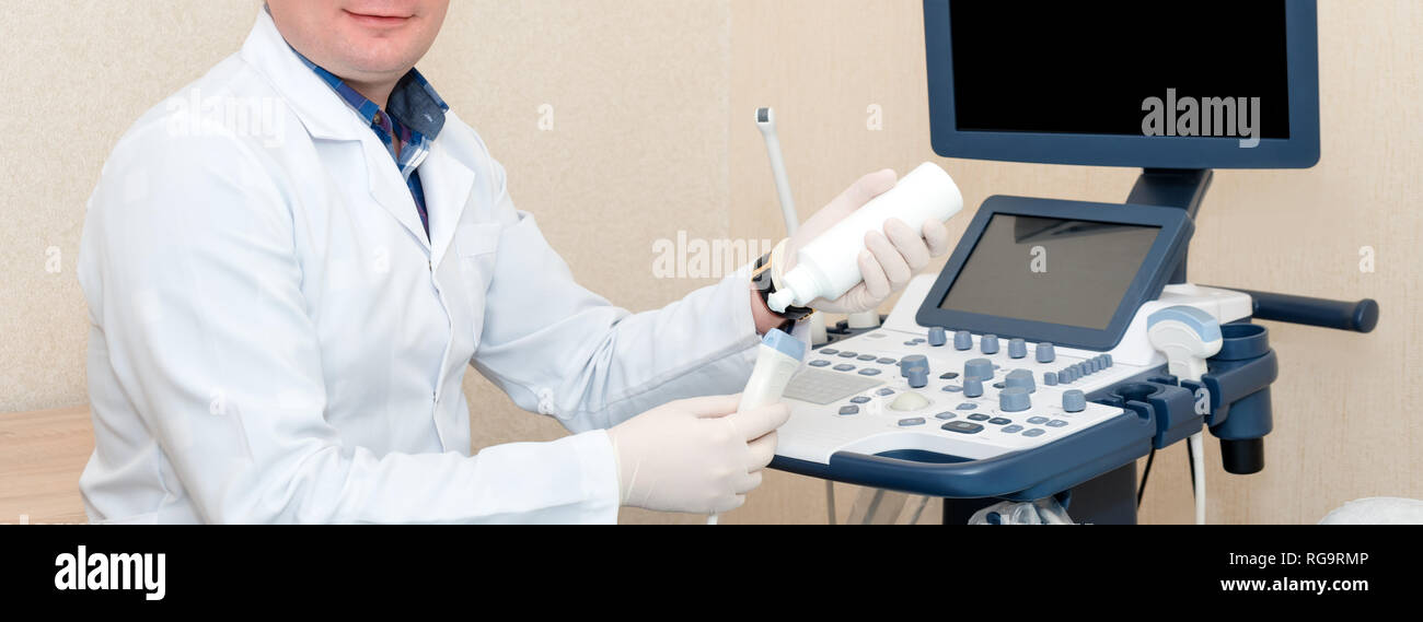 Doctor Performing Ultrasound Scan In Clinic Expecting Of Child
