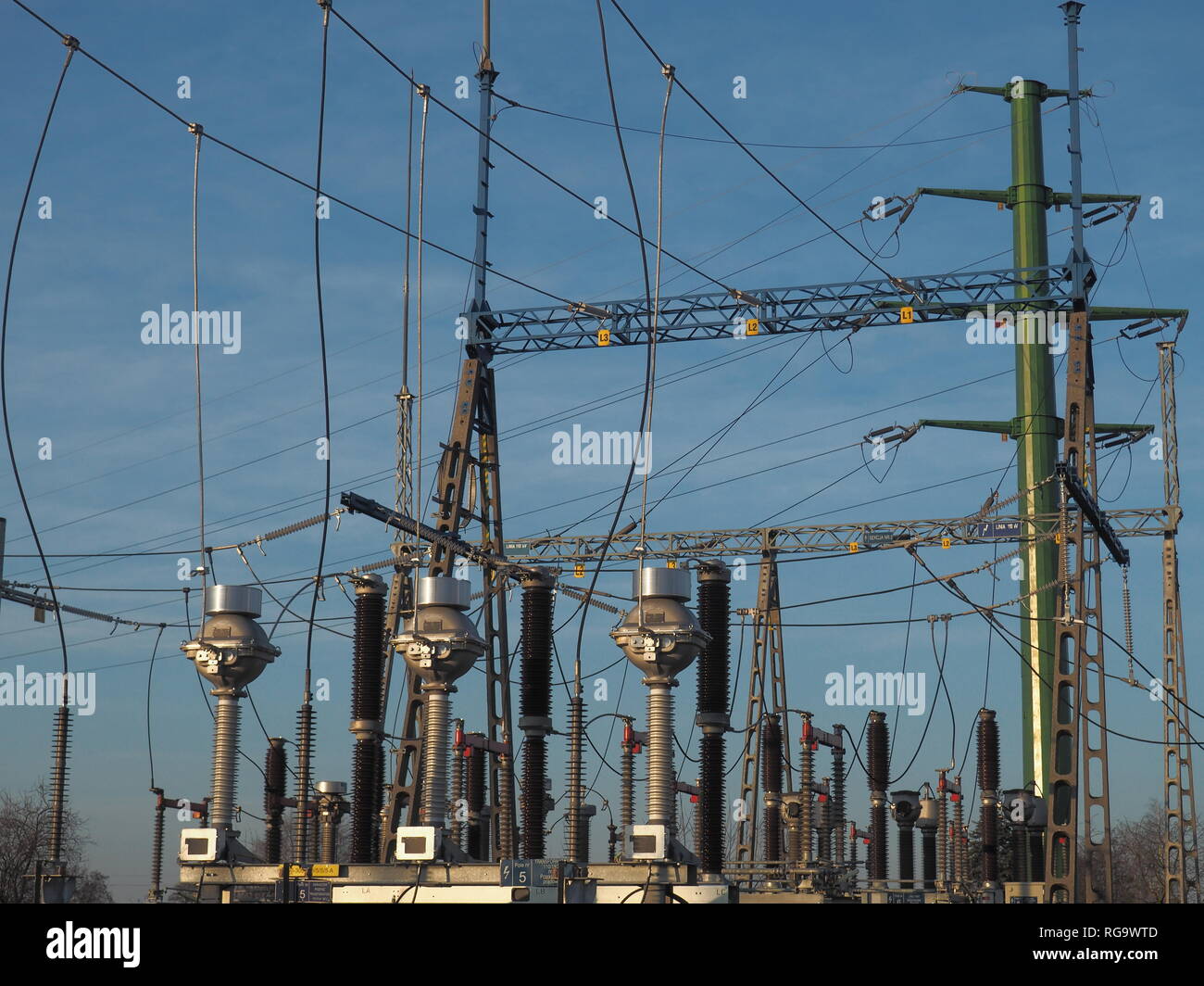 High voltage switchgear at blue sky background Stock Photo - Alamy