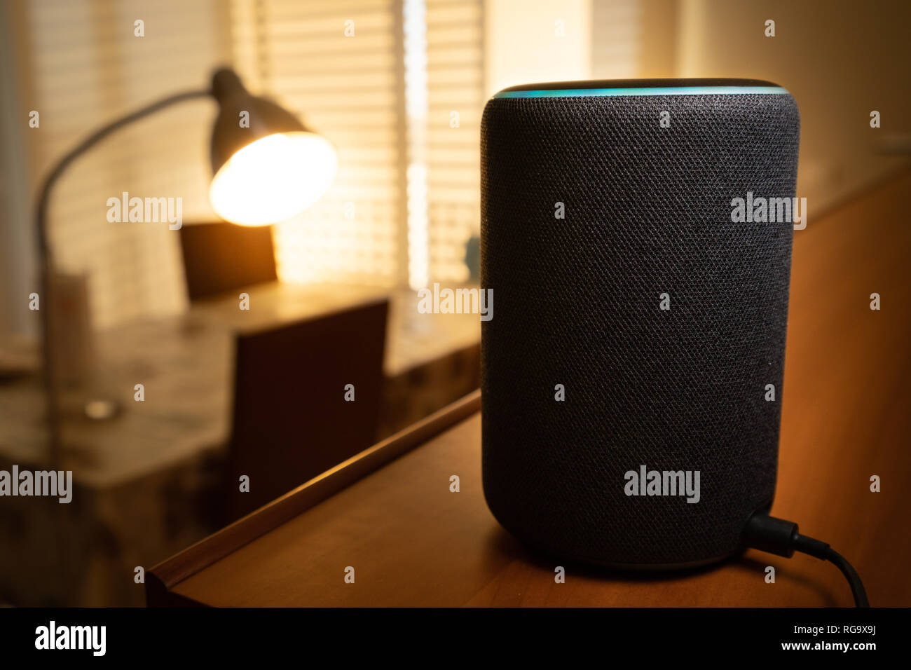 Barcelona, Spain. January 2019: Selective focus on Amazon Echo Plus smart Home device turning on a floor lamp Stock Photo