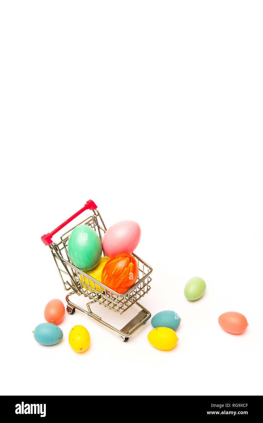 Easter shopping. Handmade colored eggs in cart. Business and selling in spring Stock Photo