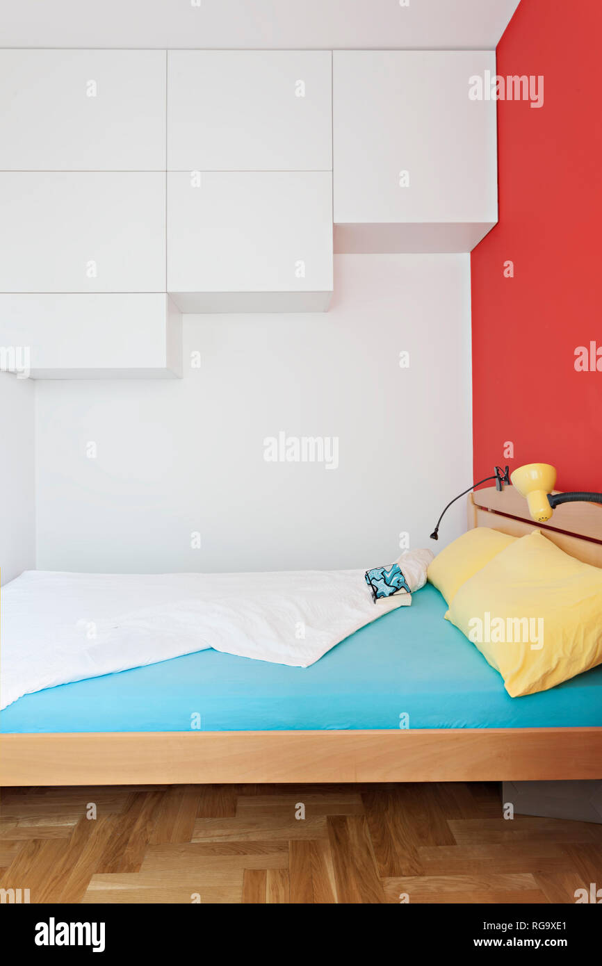 Cozy modern colorful bedroom interior with bed sheet and geometry shapes design Stock Photo